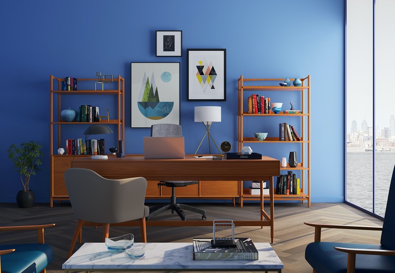 Home Office Lighting Options for Productivity View of a Home Office with a Blue Wall a Desk, and Two Bookshelves