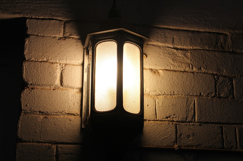 Morris LED Lighting for Fall Close Up of a Fixture Mounted to a Brick Wall
